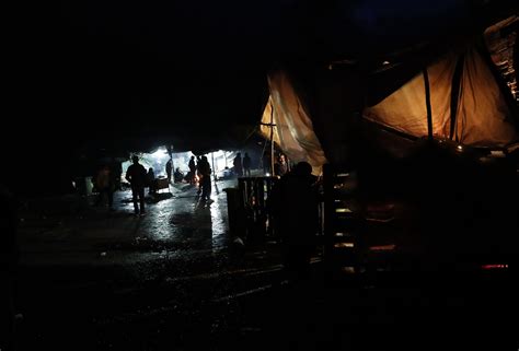 Migrants huddle in the cold in makeshift camp in Bosnia