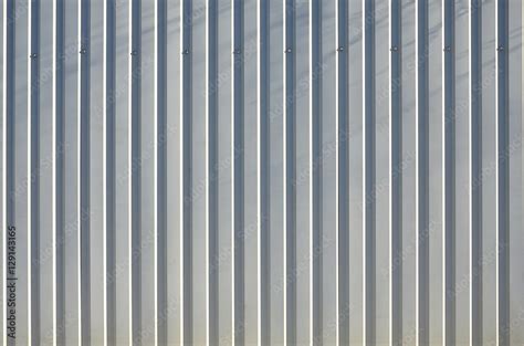 Siding, metal panels texture closeup in the daytime outdoors. Metal ...