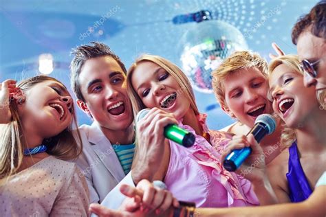 Friends singing karaoke — Stock Photo © pressmaster #101041620