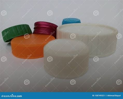 Plastic Bottle Caps of Various Shapes and Colors on White Background ...