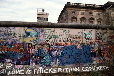 "Love is thicker than concrete": graffiti on the Berlin Wall. (Photo by ...