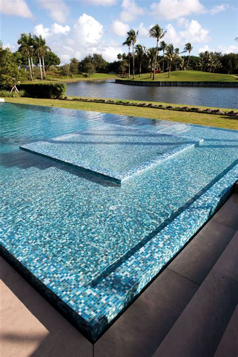 This pool has a custom 3/4"x3/4" recycled glass mosaic mix.There are ...