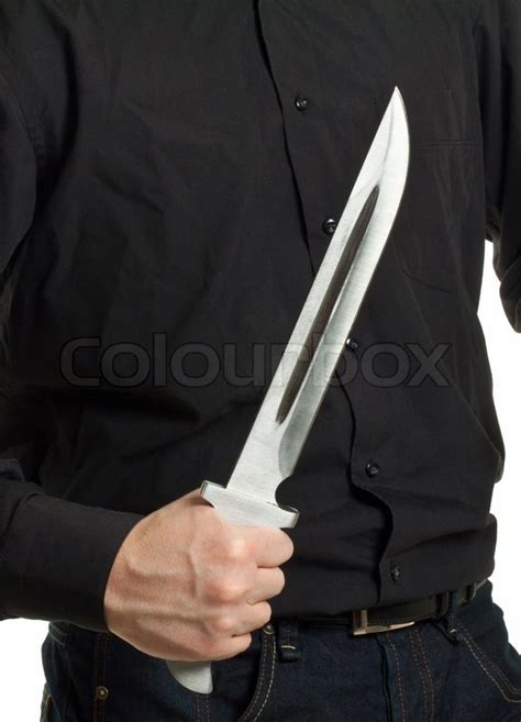 Man holding knife isolated on white ... | Stock image | Colourbox