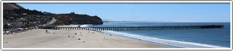 The Avila Beach Pier extends into the ocean from the Avila Promenade