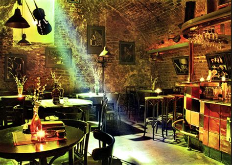 Small tables, basic chairs and exposed walls | Jazz club interior, Jazz ...