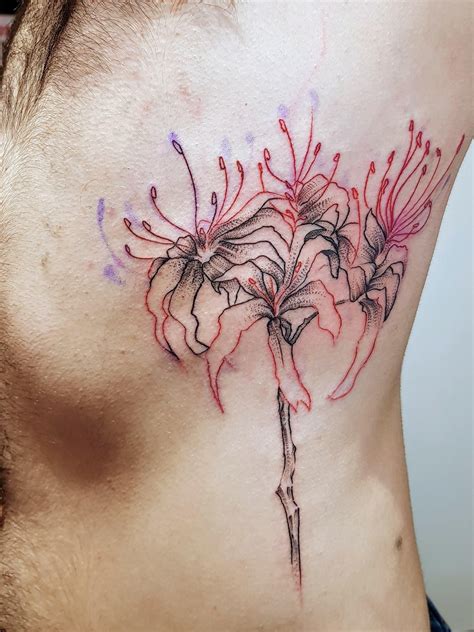 a man with a tattoo on his back has flowers in the center of his chest