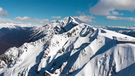 Aerial View Of Snowy Mountain Peak Stock Footage SBV-322693685 ...