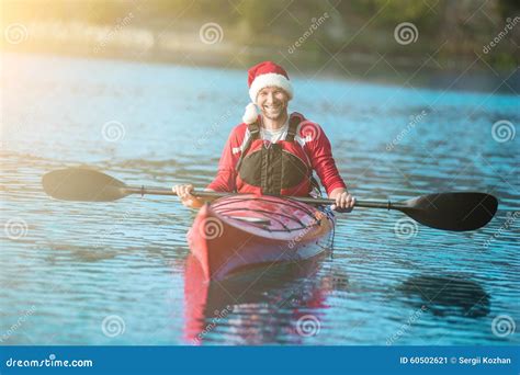 Santa kayaking stock image. Image of presentfestive, resting - 60502621