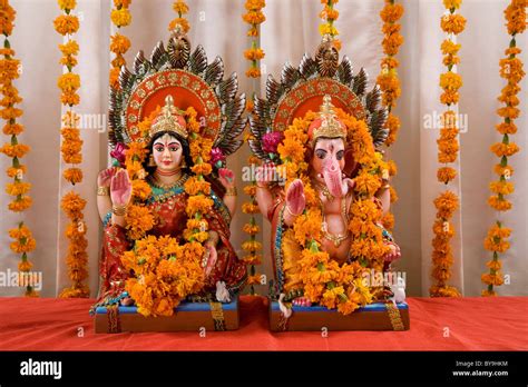 Ganesh and Lakshmi idols Stock Photo - Alamy