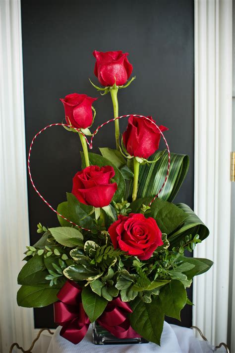 A stunning and unique Valentine's Day arrangement created with red ...