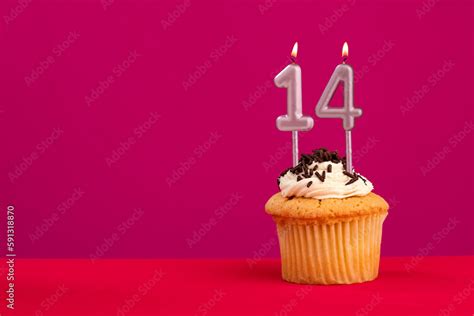 Birthday cake with candle number 14 - Rhodamine Red foamy background ...