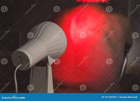 Infrared radiation therapy stock image. Image of treatment - 141152299