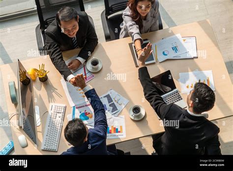 Happy business people celebrate teamwork success Stock Photo - Alamy