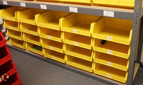 LOT OF 20 YELLOW PLASTIC STACKING STORAGE BINS - Kastner Auctions