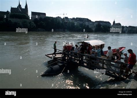 Basel with River Rhine The Rhine ferry boat is propelled Stock Photo ...