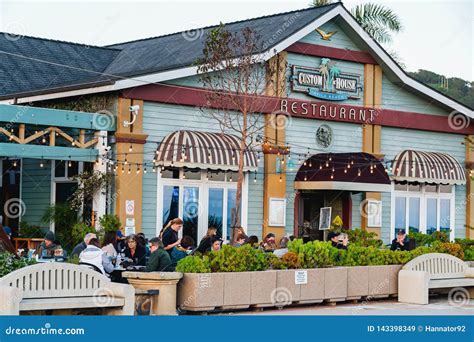 People Enjoying Dinner in Beautiful Restaurant with Ocean View in Small ...