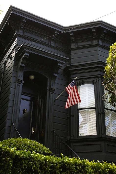 Black Houses: The Pros and Cons of a Dark Painted Facade - Gardenista