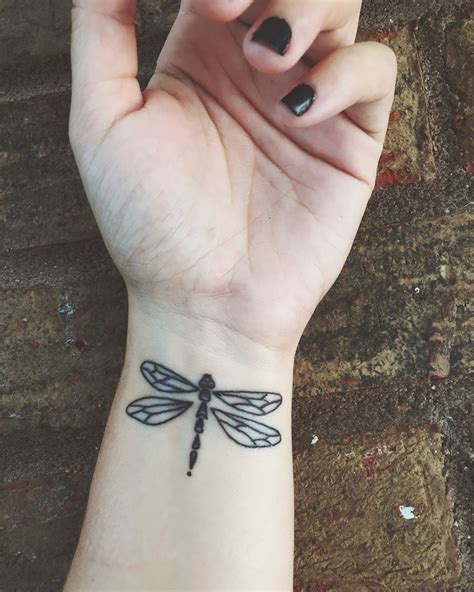 Dragonfly tattoo on wrist | Dragonfly tattoo, Dragonfly tattoo design ...