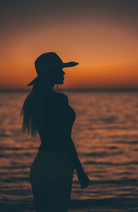 Silhouette of a Woman After Sunset by the Sea Free Stock Photo | picjumbo