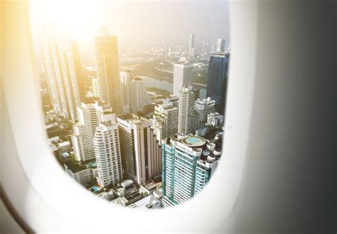 Airplane Window with City Skyscraper Stock Photo - Image of sunset ...