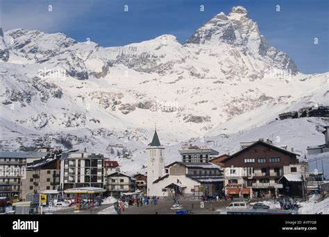 ITALY Alps Valle d'Aosta Breuil Cervinia Ski resort town with church ...