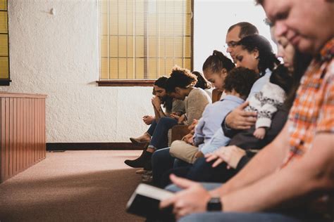 Congregation Members Praying Together - Church stock photos