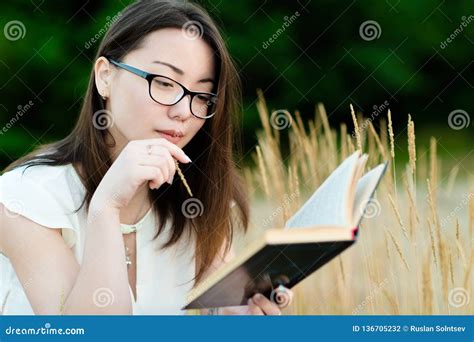 Beautiful Korean Girl Reading Book Outdoors Stock Photo - Image of ...