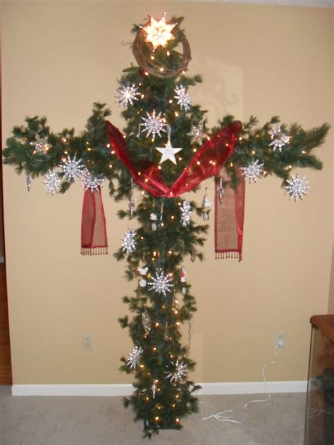 A Cross Christmas tree. Made from PCV pipe and garland. Red sash ...