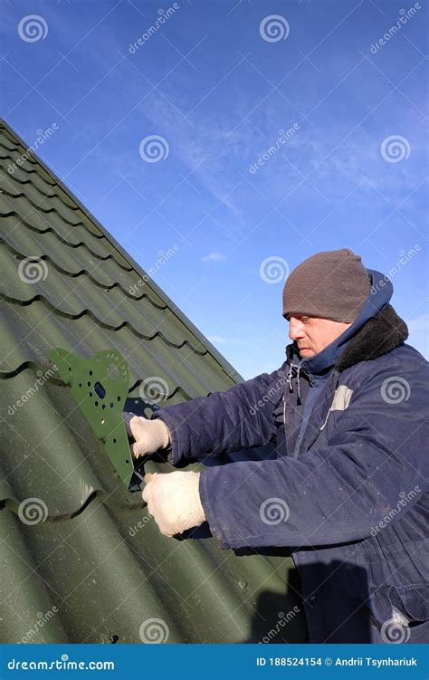 Installation by the Master on a Roof of the House of Snow Stops ...