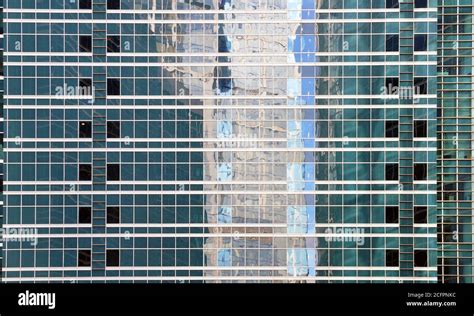 Glass square blue windows of a modern city skyscraper. Modern apartment ...