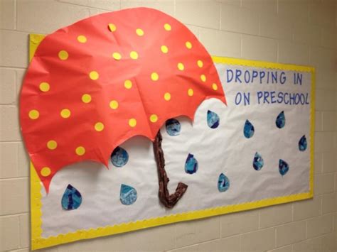 Rain/umbrella bulletin board. The kids tore tissue paper in shades of ...