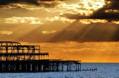 The West Pier in Brighton at sunset Photograph by Dutourdumonde ...