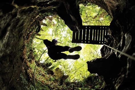 Into the Abyss: Black Water Rafting at the Waitomo Caves - Migrating Miss