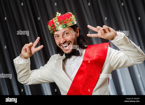 Funny king wearing crown in coronation concept Stock Photo - Alamy