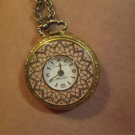 Gold pocket watch | EstateSales.org