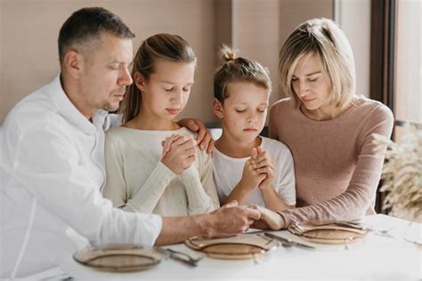 Free Photo | Family praying together before eating