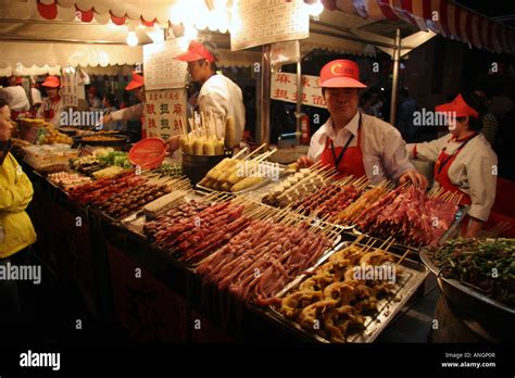 Food stall at a Night Market in Beijing China Stock Photo - Alamy