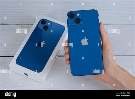 iPhone 13 in blue Stock Photo - Alamy