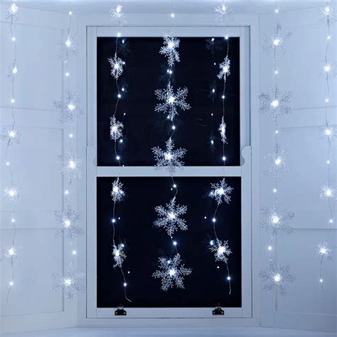 Our micro light snowflake curtain creates a winter wonderland in your ...