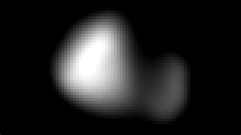 Pluto's moon Kerberos finally shows itself - BBC News