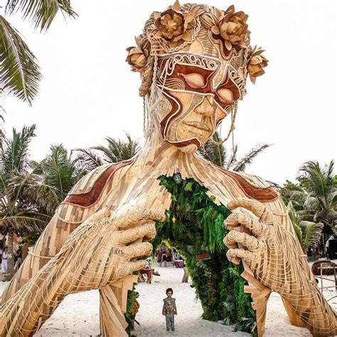 A Towering Wooden Sculpture by Daniel Popper Welcomes Beachgoers in ...