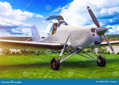 Turboprop Aircraft with Open Cockpit Pilot in the Meadow. Stock Photo ...