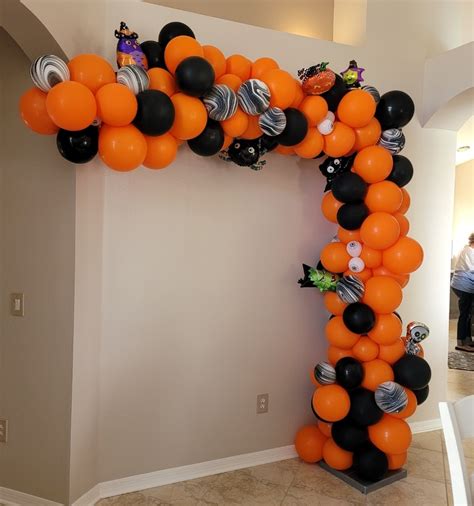 Orange and black halloween balloon arch organic with foils | YTEevents