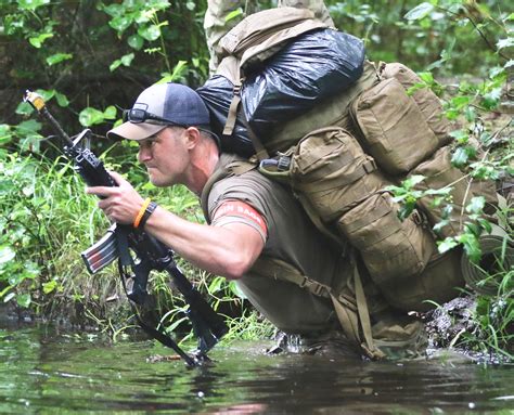 Special Forces candidate crosses a water obstacle during the final ...