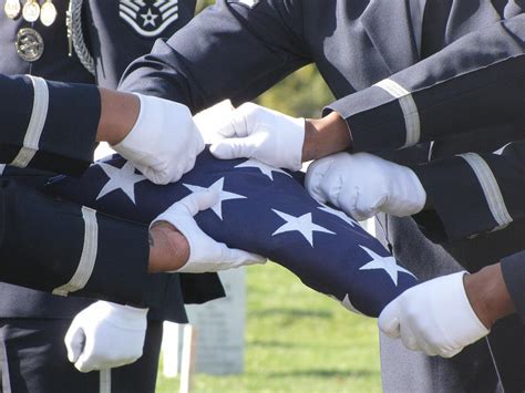 American Flag Folding at Military Funeral Service Photograph by ...