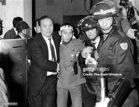 Tate-no-Kai member Masayoshi Koga is arrested after the surrender ...