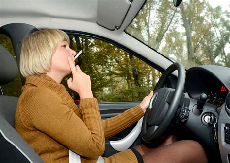 Blonde Woman Smoking Cigarette In Car Stock Photo - Download Image Now ...