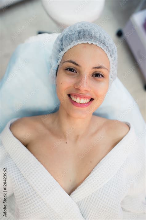 beautiful patient woman smile lying on bed in surgery room hospital ...