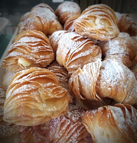 Sfogliatella is a typical pastry from Campania. Resembling stacked ...