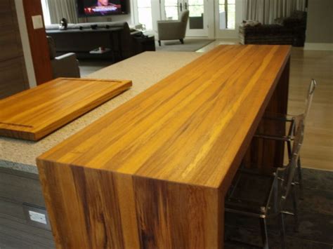 wood waterfall edge on island cabinetry | Waterfall countertop ...